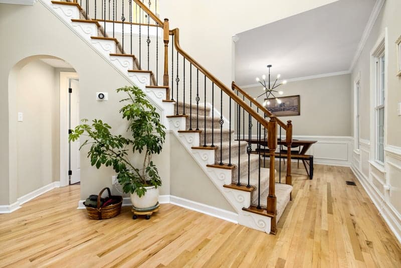 Hallway staircase with oak treads and a light oak floor
