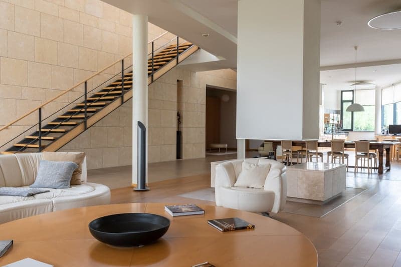 Open-plan lounge with a light wood floor